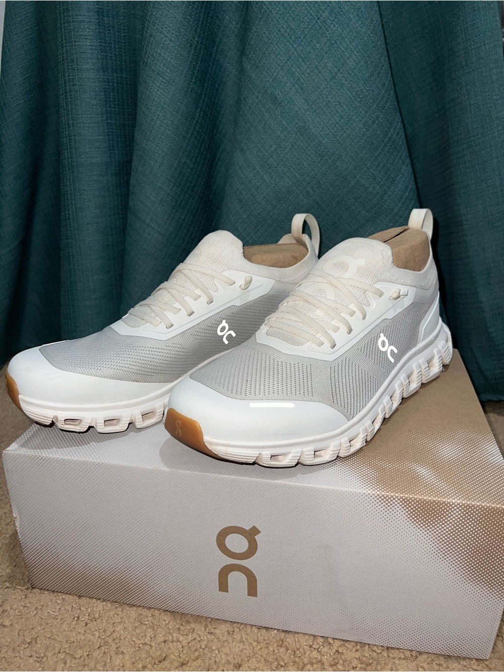On cloud womens running sneakers in white and cream accents